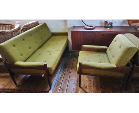 A mid 20th century Indian rosewood three piece lounge suite, with a cushioned back and seat raised upon turned and graduated 