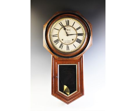 A late 19th century American walnut cased wall clock by Ansonia Clock Co., the dial signed J Wilkinson, Nantwich, the octagon