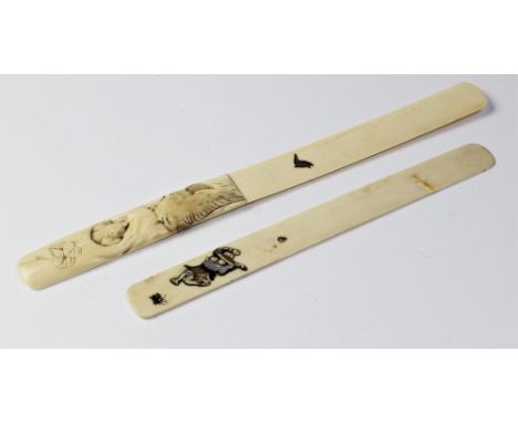 A Japanese ivory shibayama page turner, Meiji period (1868 - 1912), 28cm long, and a further similar larger example, 36cm lon