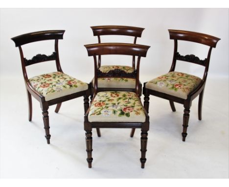 A set of six William IV rosewood dining chairs, each with a plain concave top rail above a scroll carved horizontal rail and 