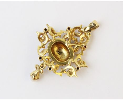 A Belle Epoque style pendant, comprising a central enamel panel decorated with flowers, set to a scrolling yellow metal borde