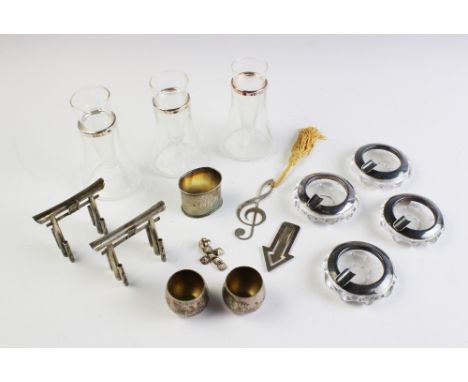 A collection of silver comprising; a pair of Tiffany &amp; Co Sterling miniature vases, each of ovoid form with gilt interior