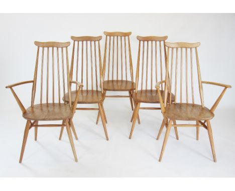 A mid 20th century Ercol blonde elm 'Golden dawn' extending dining table and eight 'Goldsmith' dining chairs, the table of re