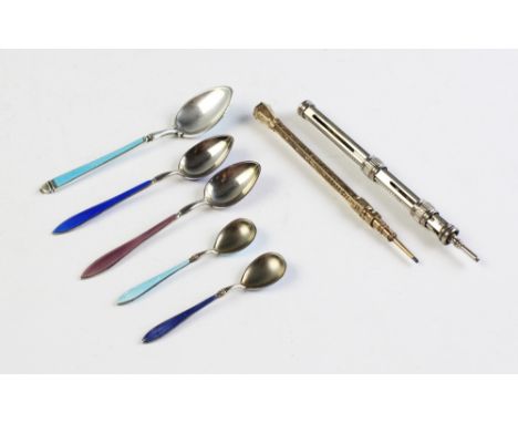 An Edwardian silver, enamel and niello teaspoon, Sheffield 1904, 11cm long, together with a pair of Norwegian silver enamelle
