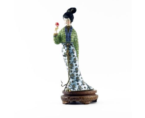 Japanese Enamel and Ivory Geisha Figurine. Depicts Geisha in traditional garb with ivory face and hand. Dent near ribbon on s