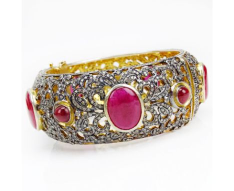Cabochon Ruby, Bench and Rose Cut Diamond, 18 Karat Yellow Gold and Silver Bangle Bracelet. Rubies with vivid saturation of c