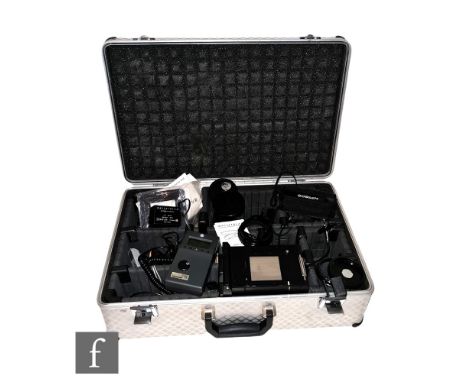 A collection of various camera accessories, to include an aluminium camera case, Hasselblad filters, Hasselblad camera lens c
