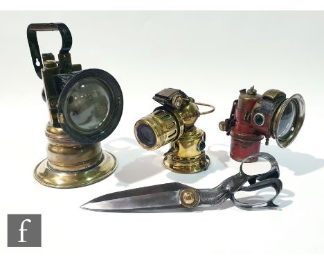 An American brass patent hand lamp dated 1927, stamped I.R.T Co.S.D, No 167, height 30cm, a Monarch model brass carbide lamp,