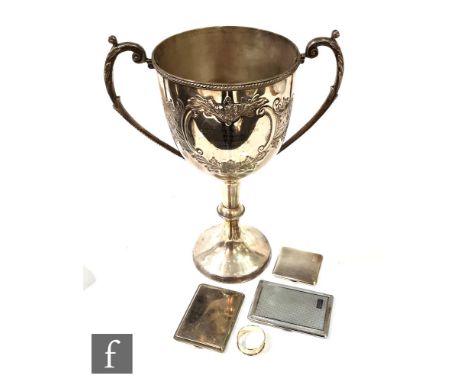 An engine turned silver cigarette case, a napkin ring, two plated cigarette cases and a trophy cup inscribed to an indoor soc