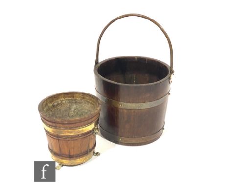 A 20th Century coopered oak swing handled log basket, width 30cm, and a similar circular planter, width 23cm. (2) 