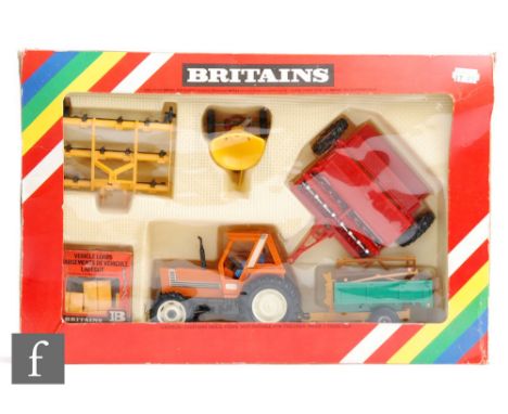 A Britains 9591 1:32 scale Fiat Tractor and Implement Set, boxed. 