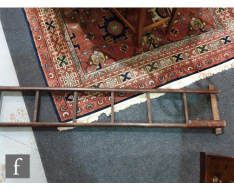 A 19th Century pitch pine nine rung library pole ladder, with metamorphic collapsing action, height when opened 286cm and wid