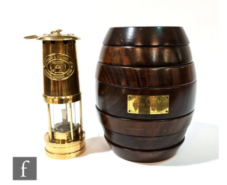 A Remy Martin turned wood games compendium in the form of a seven sectional barrel and a polished brass miner's lamp by S. Th