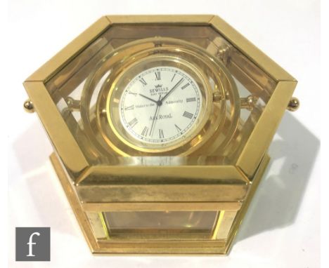 A contemporary Sewills Ark Royal gimbal desk clock, in polished brass and glazed hexagonal case with a quartz movement, heigh