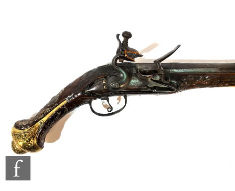 A late 18th to early 19th Century flintlock holster pistol, indistinctly signed to lock possibly L D, brass inlaid wire and s