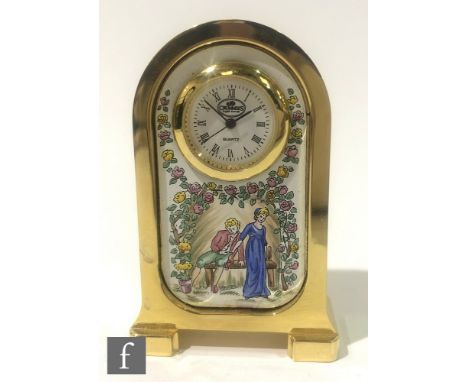 A contemporary Crummles English enamels miniature brass clock of arched form, the enamelled front panel detailed with a coupl