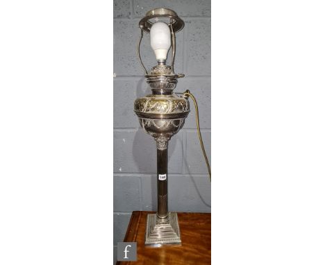A Victorian plated Corinthian column table lamp with detach eagle reservoir on beaded square base, converted with shade, heig