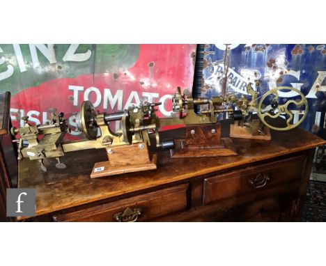 A collection of watch makers tools to include a brass lathe with hand crack operation, length 52cm, a similar lathe, length 3