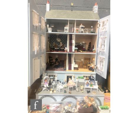 A contemporary three storey dolls house built from a Dolls House Emporium Classical Dolls house kit with hinged roof attic, s