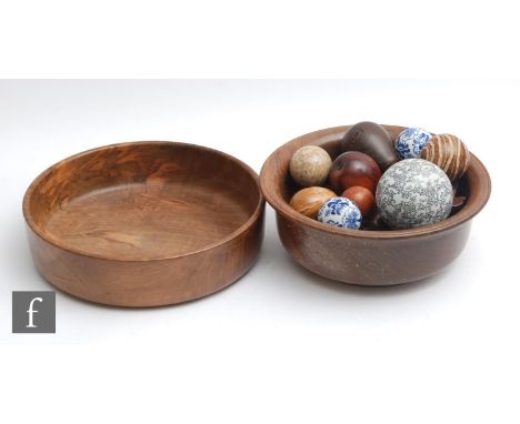 Two post 1950s walnut fruit bowls and carved simulated fruit and a quantity of ceramic coloured carpet bowls. (qty) 