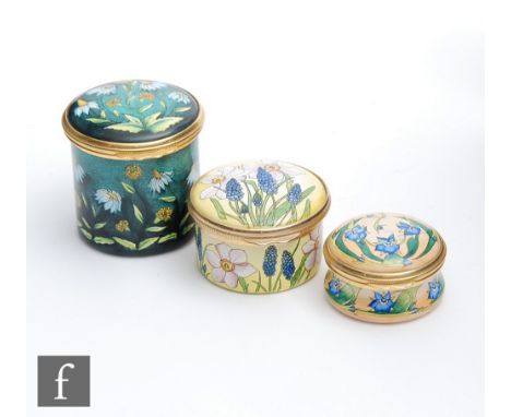 Three Moorcroft Enamel trinket boxes each with hand painted floral decoration, all boxed, largest height 4.5cm. (3) 