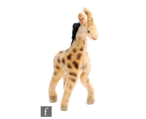 A Steiff Giraffe, blonde mohair with airbrushed detail, height 25cm. 
