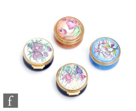 Four assorted Moorcroft Enamel miniature trinket boxes each decorated with flowers, printed mark, boxed, diameter 3cm. (4) 