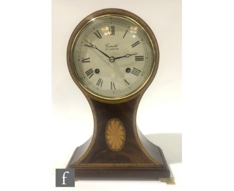 A contemporary mahogany veneered balloon mantel clock by Comitti of London, raised to polished brass feet, height 29.5cm, S/D