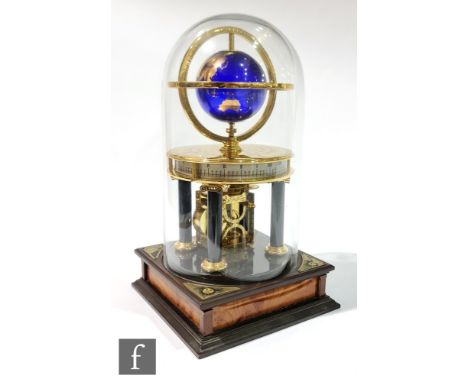 A contemporary Millennium Clock, with gilded blue glass globe and moon within a hemispherical frame, all over a compass engra