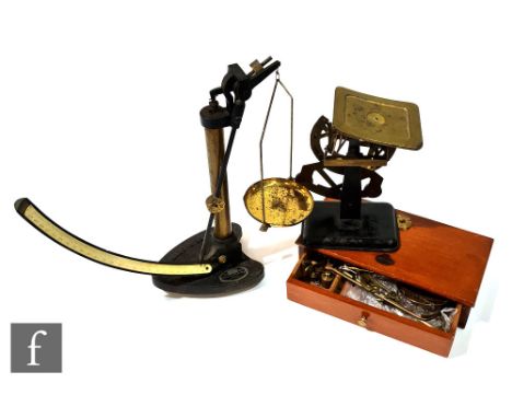 An early 20th Century set of brass chemist balances by John Bell Croydon &amp; London, in fitted mahogany case, a set of bila