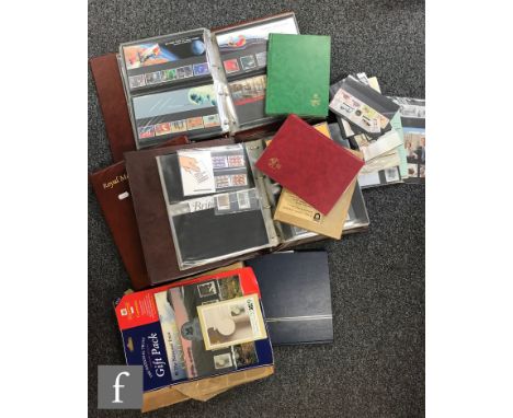 A collection of Queen Elizabeth II Great British postage stamps, to include three Royal Mail presentation packs albums, mint,