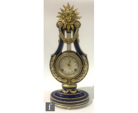 A contemporary replica of the Victoria and Albert museum Marie-Antoinette clock, the blue porcelain body of lyre form with gi