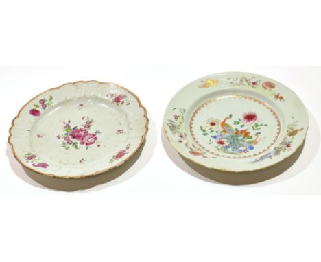 Two 18th century Chinese porcelain famille rose plates, one with a floral design, the other with a peacock with cranes to the