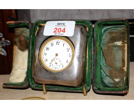 French gilt metal cased circular faced bedside clock, with hallmarked silver mount in case, 7cm wide  