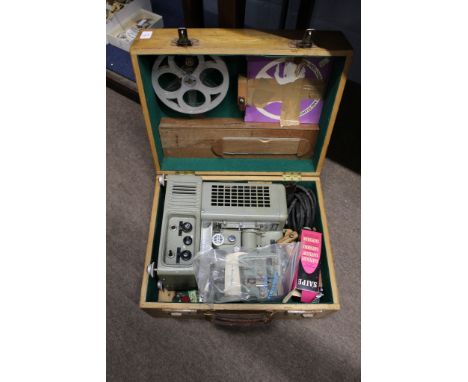 Ditmar vintage movie projector in a light oak case  