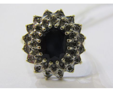 9ct YELLOW GOLD SAPPHIRE &amp; DIAMOND CLUSTER RING, principal oval cut sapphire surrounded by illusion set brilliant cut dia