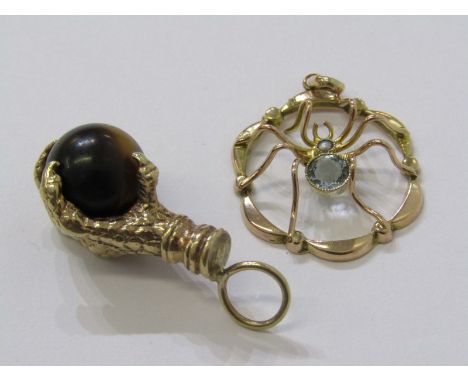 2 x 9ct PENDANTS, 1 eagle claw holding a tiger eye stone ball, other in the form of a spider with topaz seed and pearl body, 