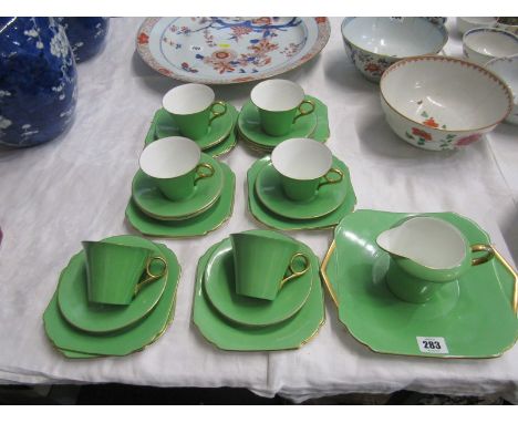 SHELLEY, Art Deco green and gilt glazed tea service of 6 trios, cream jug, bread plate, together with 5 additional saucers an