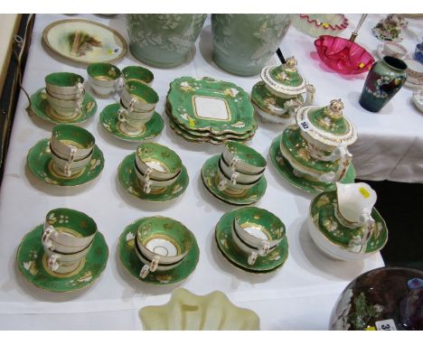 ROCKINGHAM-STYLE, apple green ground and gilt teaware, to include tea pot, sucrier jug, assorted plates and teaware 