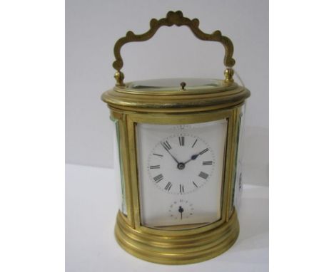 REPEATER CARRIAGE CLOCK, oval cased bevel glass carriage clock with coiled bar strike and secondary dial, 15.5cm height 