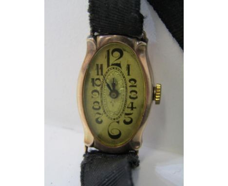 VINTAGE 9ct GOLD LADY'S COCKTAIL WATCH, movement appears to be in working condition on vintage material bracelet 