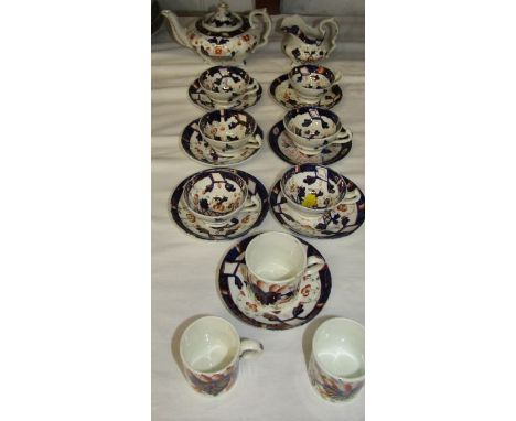 GAUDY WELSH STYLE MINIATURE TEA SERVICE, 19th Century splash lustre tea and coffee ware, including tea pot, jug and coffee ca