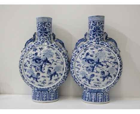 ORIENTAL CERAMICS, pair of Chinese underglaze blue twin dragon handled moon flasks decorated with dancing temple dogs, 36cm h