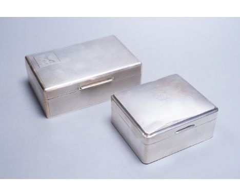 A late 1950's engine turned silver mounted rectangular cigarette box, by Mappin &amp; Webb, 14cm and one other smaller silver