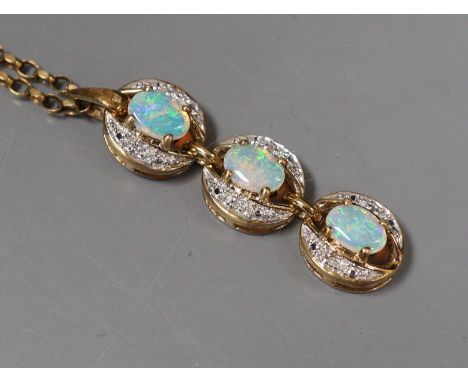 A modern 9ct gold, opal and diamond chip set triple cluster line pendant 43mm, on a 9ct gold chain, 45cm, gross weight 9.8 gr