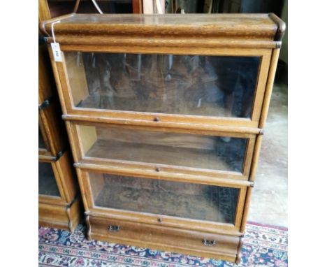 A Globe Wernicke oak three section bookcase, width 86cm, depth 27cm, height 119cm**CONDITION REPORT**PLEASE NOTE:- Prospectiv