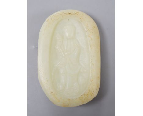 A Chinese celadon jade pebble carving depicting Guanyin, 7.5cm tall**CONDITION REPORT**PLEASE NOTE:- Prospective buyers are s