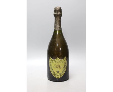 A single bottle of Dom Perignon champagne, 1980 vintage**CONDITION REPORT**PLEASE NOTE:- Prospective buyers are strongly advi