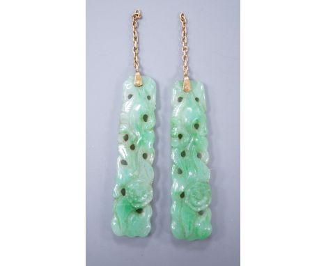 A pair of carved jade earrings, lacking mounts, 37mm.**CONDITION REPORT**PLEASE NOTE:- Prospective buyers are strongly advise