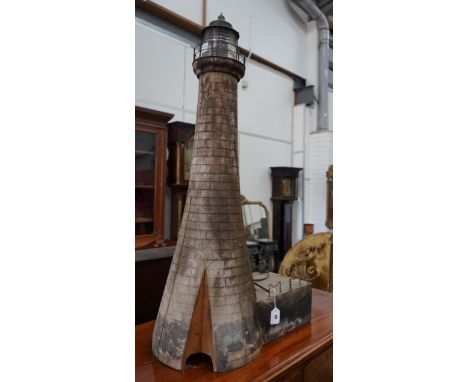 A vintage brick effect wood model lighthouse, wired for electricity height 110cm**CONDITION REPORT**PLEASE NOTE:- Prospective